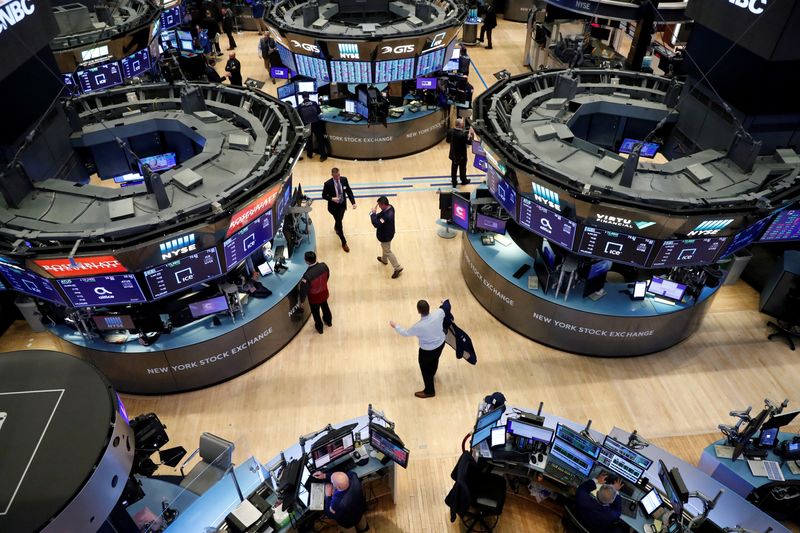 &copy; Reuters. FILE PHOTO: Traders work on the floor of the New York Stock Exchange (NYSE) in New York, U.S., March 19, 2020. REUTERS/Lucas Jackson/File Photo