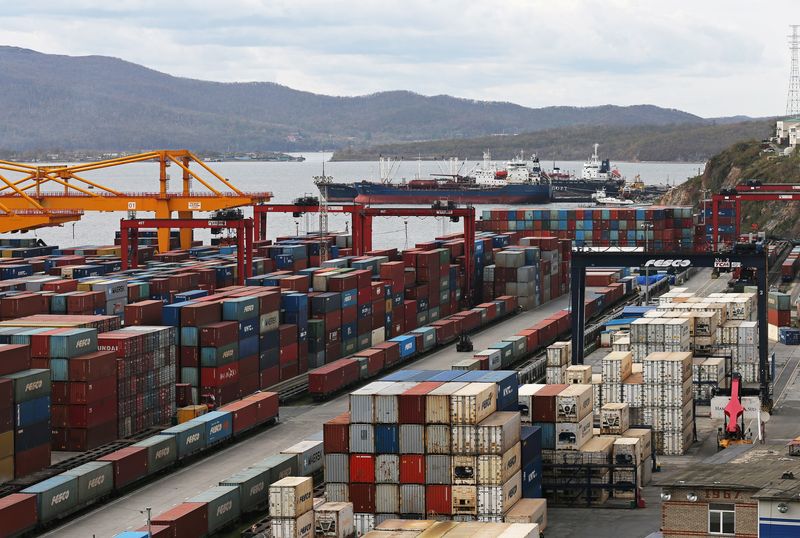 © Reuters. Stacked shipping containers are pictured at a commercial port in Vladivostok, Russia October 18, 2021.  REUTERS/Tatiana Meel