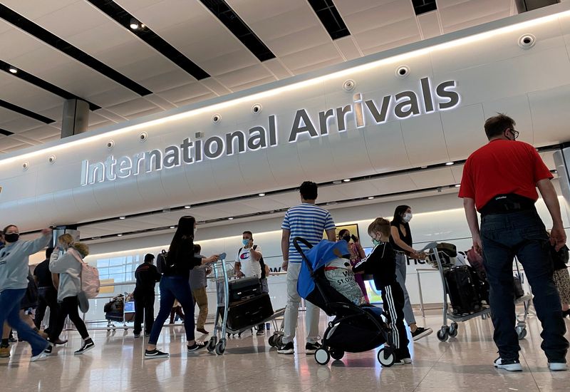 &copy; Reuters. FILE PHOTO:  Passengers from international flights arrive at Heathrow Airport, following the outbreak of the coronavirus disease (COVID-19), London, Britain, July 29, 2020. REUTERS/Toby Melville