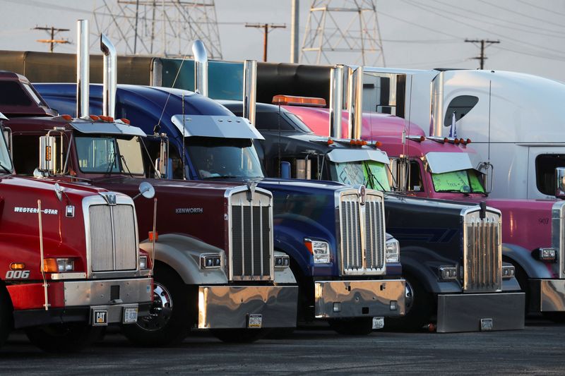 &copy; Reuters. Truckers and their supporters start to gather before a convoy leaves the following morning bound for the nation's capital to protest against coronavirus disease (COVID-19) vaccine mandates, in Adelanto, California, U.S., February 22, 2022.  REUTERS/David 