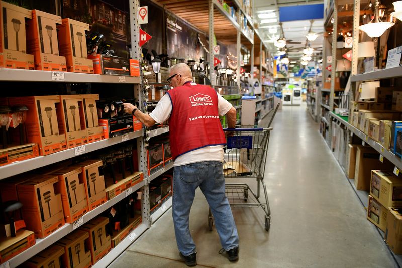 &copy; Reuters. FILE PHOTO - An employee restocks items at a Lowe's home improvement chain in Austin, Texas, U.S., February 27, 2017. Picture taken February 27, 2017. REUTERS/Mohammad Khursheed