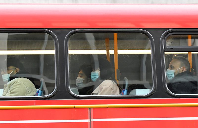 &copy; Reuters. Passengers wearing protective face masks ride on a London bus, as rules on wearing face coverings in some settings in England are relaxed, amid the spread of the coronavirus disease (COVID-19) pandemic, in London, Britain, January 27, 2022. REUTERS/Toby M