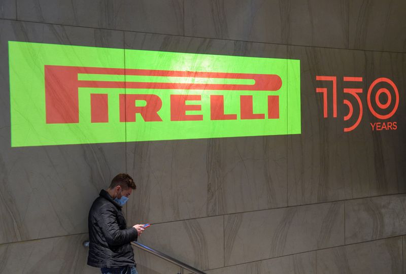 &copy; Reuters. FILE PHOTO: A person uses the phone near a Pirelli logo during the 150th anniversary celebration of Italian tyremaker in Milan, Italy, January 28, 2022. REUTERS/Flavio Lo Scalzo