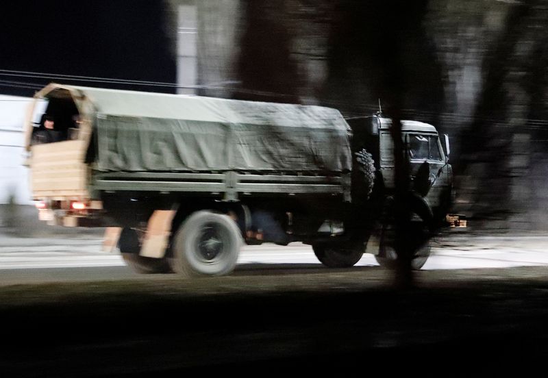 &copy; Reuters. A military truck drives along a street after Russian President Vladimir Putin ordered the deployment of Russian troops to two breakaway regions in eastern Ukraine following the recognition of their independence, in the separatist-controlled city of Donets
