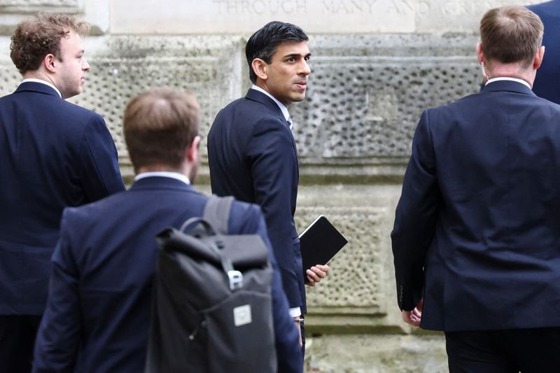 &copy; Reuters. FILE PHOTO: British Chancellor of the Exchequer Rishi Sunak walks at Downing Street, in London, Britain February 22, 2022. REUTERS/Henry Nicholls