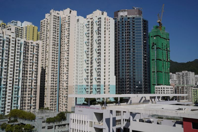 &copy; Reuters. FILE PHOTO: A residential development, in which Evergrande, according to sources, has transferred unsold units to its joint-venture partner VMS Group, is pictured among other buildings in Hong Kong, China, November 27, 2021. REUTERS/Lam Yik