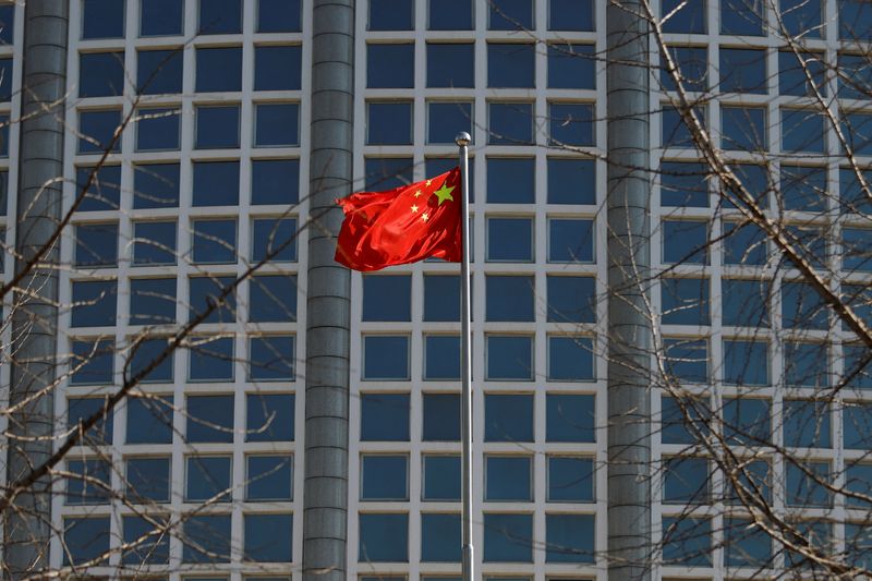 &copy; Reuters. A Chinese flag flutters outside the Chinese foreign ministry in Beijing, China February 24, 2022. REUTERS/Carlos Garcia Rawlins