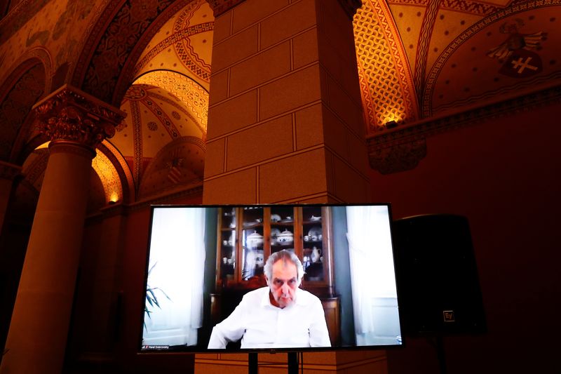 &copy; Reuters. FILE PHOTO - Czech Republic's President Milos Zeman appears on a screen during a Visegrad Group meeting in the Museum of Fine Arts in Budapest, Hungary, November 29, 2021. REUTERS/Bernadett Szabo