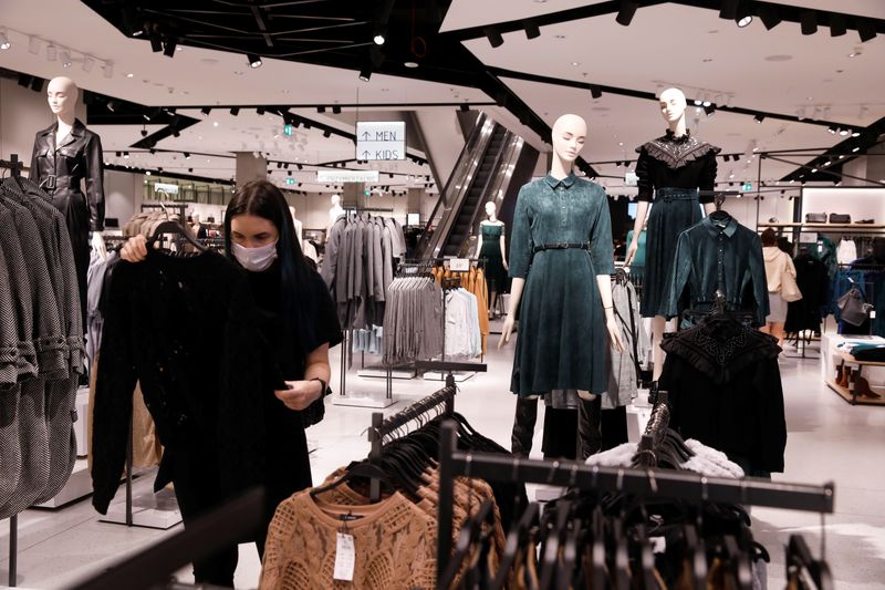 &copy; Reuters. FILE PHOTO: A woman looks at cloth at Polish fashion retailer LPP brand Reserved shop, amid the coronavirus disease (COVID-19), in Warsaw, Poland, September 4, 2020. Picture taken September 4, 2020. REUTERS/Kacper Pempel