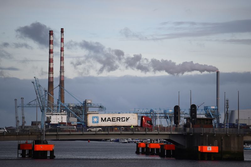 &copy; Reuters. FILE PHOTO - A truck driving a Maersk shipping container drives past Poolbeg Generating Station owned by the Electricity Supply Board beside the Port in Dublin, Ireland, February 11, 2022. REUTERS/Clodagh Kilcoyne