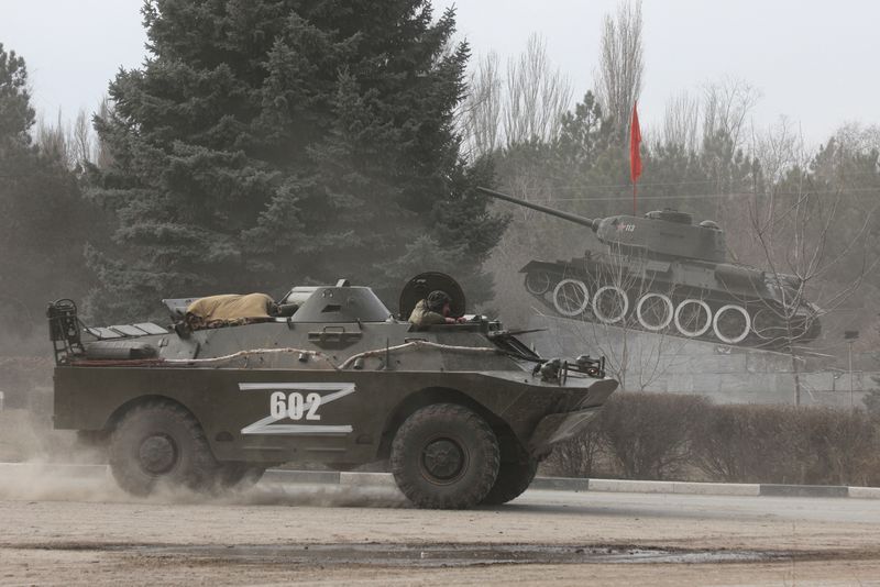 &copy; Reuters. Russian Army military vehicle with the letter 'Z' on it drives past a monument displaying a Soviet-era tank, after Russian President Vladimir Putin authorized a military operation in eastern Ukraine, in the town of Armyansk, Crimea, February 24, 2022. REU