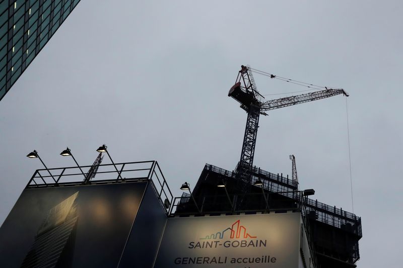 &copy; Reuters. FILE PHOTO: The Logo of  Saint-Gobain is seen in a banner on a construction building site the financial and business district of La Defense, west of Paris, France February 19, 2018. REUTERS/Gonzalo Fuentes