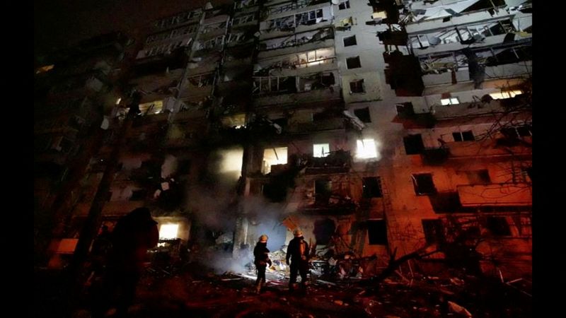 &copy; Reuters. Firefighters work at the site of a damaged residential building, after Russia launched a massive military operation against Ukraine, in Kyiv, Ukraine, February 25, 2022 in this frame grab of a still image use in a video.  Ukrainian Ministry of Emergencies