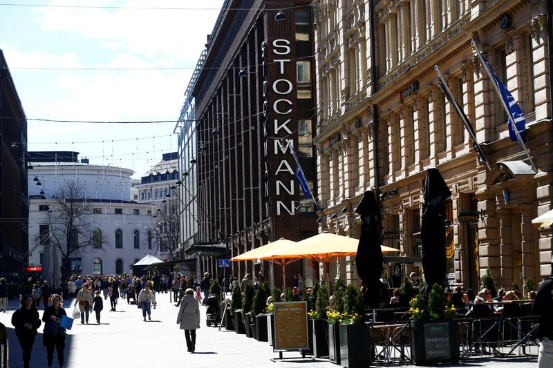 &copy; Reuters. FILE PHOTO: People walk past Stockmann shopping center in Helsinki, Finland, May 6, 2017. REUTERS/Ints Kalnins