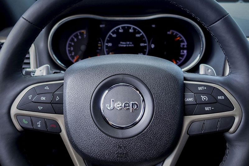 &copy; Reuters. FILE PHOTO: The logo of Jeep is seen on a steering wheel of the 2015 Jeep Grand Cherokee on a car dealership in New Jersey, July 24, 2015. REUTERS/Eduardo Munoz