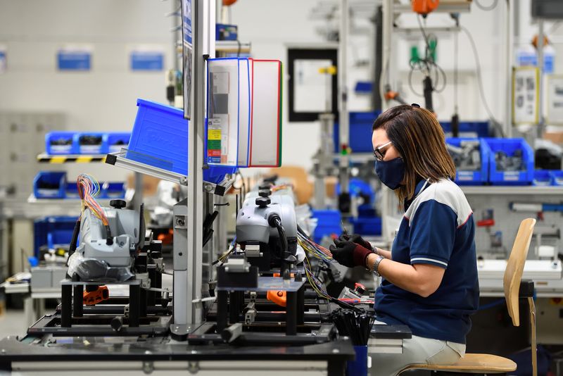 &copy; Reuters. FILE PHOTO: A woman works at MTA factory in Codogno, one year after the small northern town became Europe's coronavirus disease (COVID-19) epicentre, in Codogno, Italy, February 10, 2021. Picture taken February 10, 2021. REUTERS/Flavio Lo Scalzo