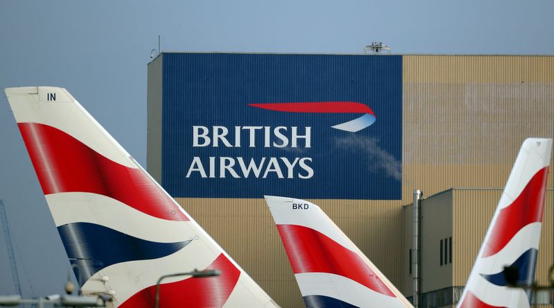 &copy; Reuters. FILE PHOTO: British Airways logos are seen on tail fins at Heathrow Airport in west London, Britain, February 23, 2018. REUTERS/Hannah McKay/File Photo