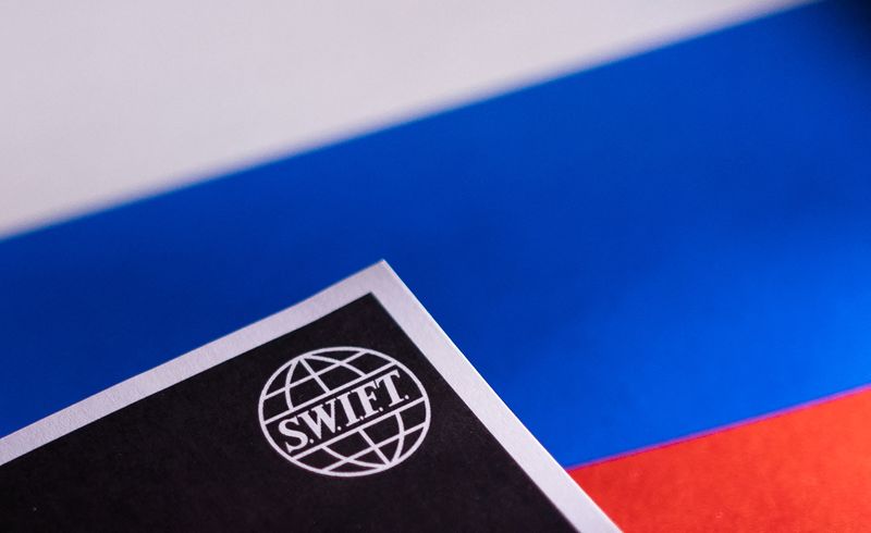 &copy; Reuters. Swift logo is placed on a Russian flag are seen in this illustration taken, Bosnia and Herzegovina, February 25, 2022. REUTERS/Dado Ruvic/Illustration