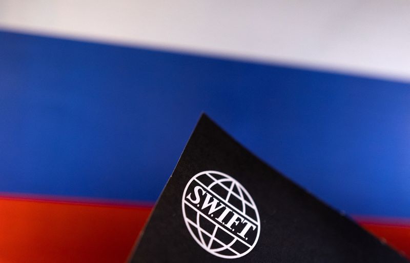 &copy; Reuters. Swift logo is placed on a Russian flag are seen in this illustration taken, Bosnia and Herzegovina, February 25, 2022. REUTERS/Dado Ruvic/Illustration