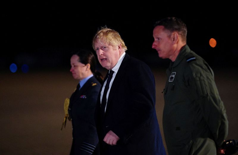 &copy; Reuters. FILE PHOTO: British Prime Minister Boris Johnson walks during a visit at Royal Air Force (RAF) Brize Norton station to meet military personnel and thank them for their work facilitating military support to Ukraine and NATO, at RAF Brize Norton, Britain, F