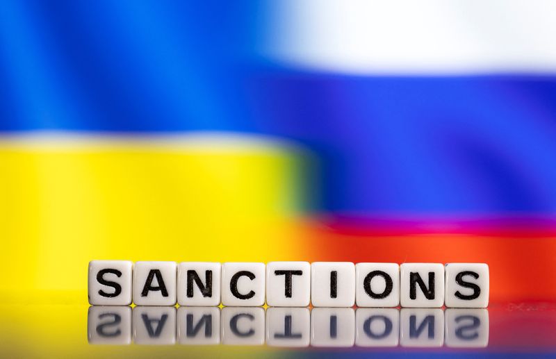 &copy; Reuters. FILE PHOTO: Plastic letters arranged to read "Sanctions" are placed in front of Ukraine's and Russia's flag colors  in this illustration taken February 25, 2022. REUTERS/Dado Ruvic/Illustration