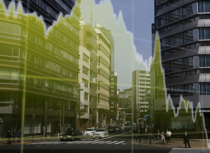 &copy; Reuters. FILE PHOTO: A businessman and office buildings are reflected on an electronic board showing a graph of the Japanese yen's exchange rate against the U.S. dollar outside a brokerage in Tokyo, Japan, April 20, 2016.   REUTERS/Toru Hanai