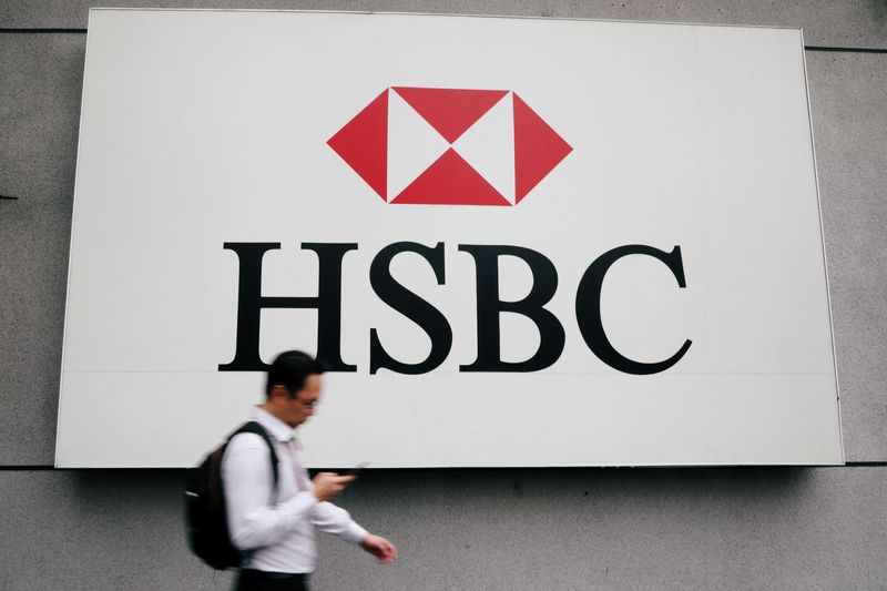 &copy; Reuters. FILE PHOTO: A man walks past a logo of HSBC at its headquarters in Kuala Lumpur, Malaysia August 6, 2019. REUTERS/Lim Huey Teng