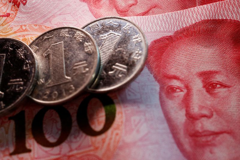 &copy; Reuters. Coins and banknotes of China's yuan are seen in this illustration picture taken February 24, 2022. REUTERS/Florence Lo/Illustration