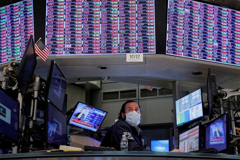 &copy; Reuters. FILE PHOTO: A specialist trader works inside a booth on the floor of the New York Stock Exchange (NYSE) in New York City, U.S., January 18, 2022.  REUTERS/Brendan McDermid