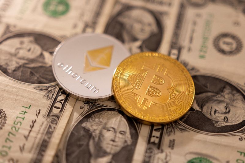 &copy; Reuters. FILE PHOTO: A representations of cryptocurrency bitcoin and Ethereum placed on U.S. dollars in this illustration taken, January 24, 2022. REUTERS/Dado Ruvic/Illustration