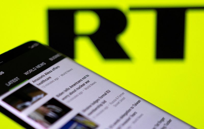 &copy; Reuters. FILE PHOTO: RT app is seen on a smartphone in front of their logo in this illustration taken February 28, 2022. REUTERS/Dado Ruvic/Illustration