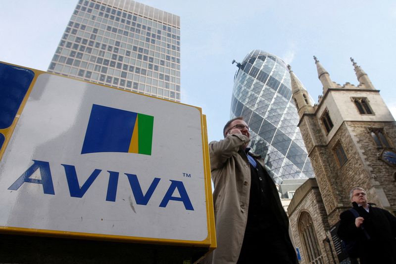 &copy; Reuters. FILE PHOTO: Pedestrians walk past an Aviva logo outside the company's head office in the city of London March 5, 2009.   REUTERS/Stephen Hird   