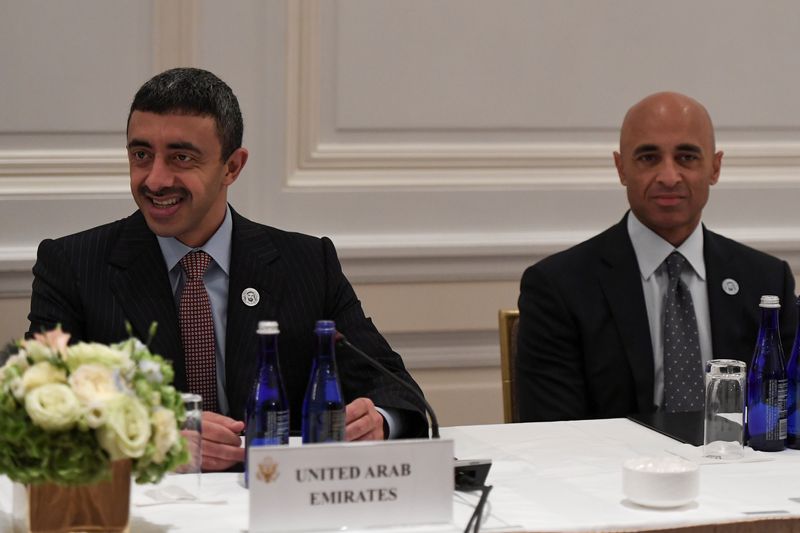 &copy; Reuters. يوسف العتيبة سفير الإمارات لدى الولايات المتحدة (في اليمين) يجلس إلى جوار وزير خارجية الإمارات. صورة من أرشيف رويترز.