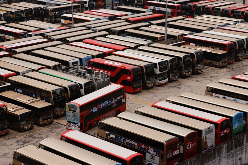 © Reuters. Kowloon Motor Bus (KMB) double-decker buses are seen parked at a bus depot, after services were cut as coronavirus disease (COVID-19) cases surge in Hong Kong, China, March 3, 2022. REUTERS/Tyrone Siu