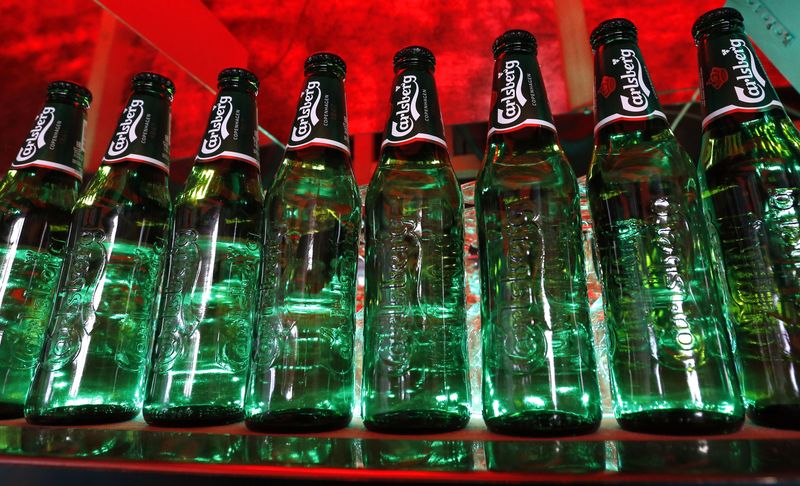 &copy; Reuters. FILE PHOTO: Bottles of Carlsberg beer are seen in a bar in St. Petersburg June 17, 2014. To match Interview CARLSBERG-RUSSIA/REUTERS/Alexander Demianchuk 