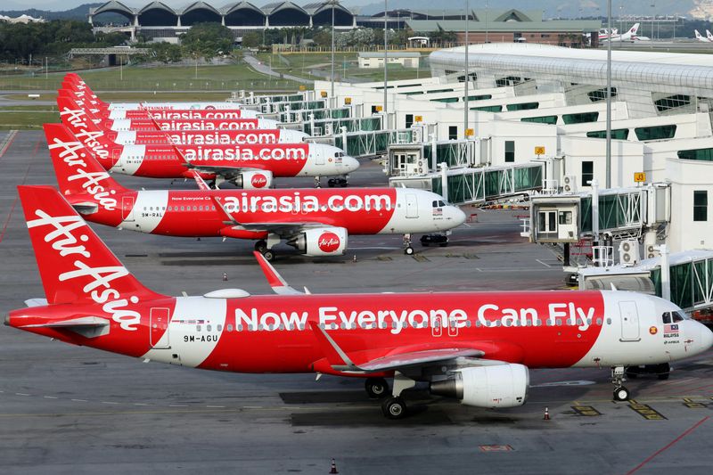 &copy; Reuters. FILE PHOTO: Airasia planes are seen parked at Kuala Lumpur International Airport 2, amid the coronavirus disease (COVID-19) outbreak in Sepang, Malaysia October 6, 2020. REUTERS/Lim Huey Teng