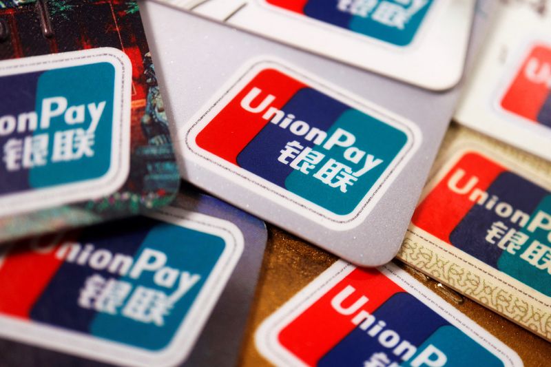 © Reuters. UnionPay cards are seen displayed in this illustration picture taken March 7, 2022. REUTERS/Florence Lo/Illustration