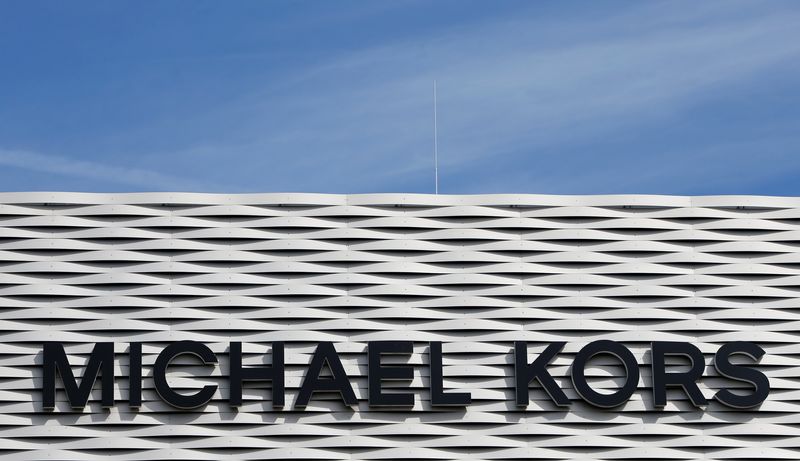 &copy; Reuters. FILE PHOTO: The logo of Michael Kors is seen on an outlet store in Metzingen, Germany, June 16, 2017.  REUTERS/Michaela Rehle