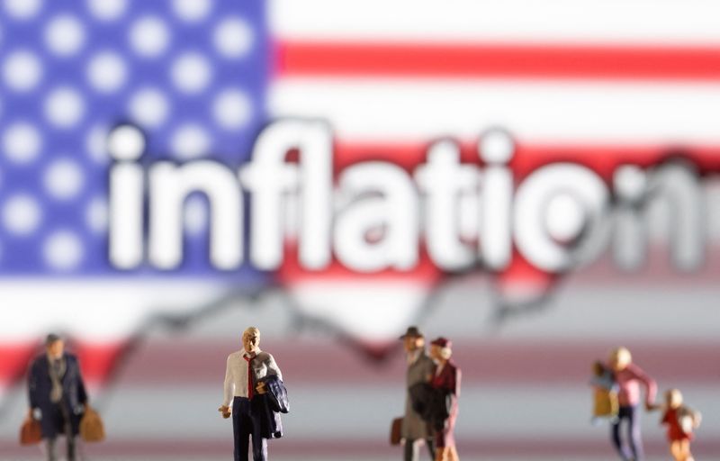 &copy; Reuters. Small figurines are seen in front of displayed word "Inflation", U.S. flag and rising stock graph in this illustration taken February 11, 2022. REUTERS/Dado Ruvic/Ilustration