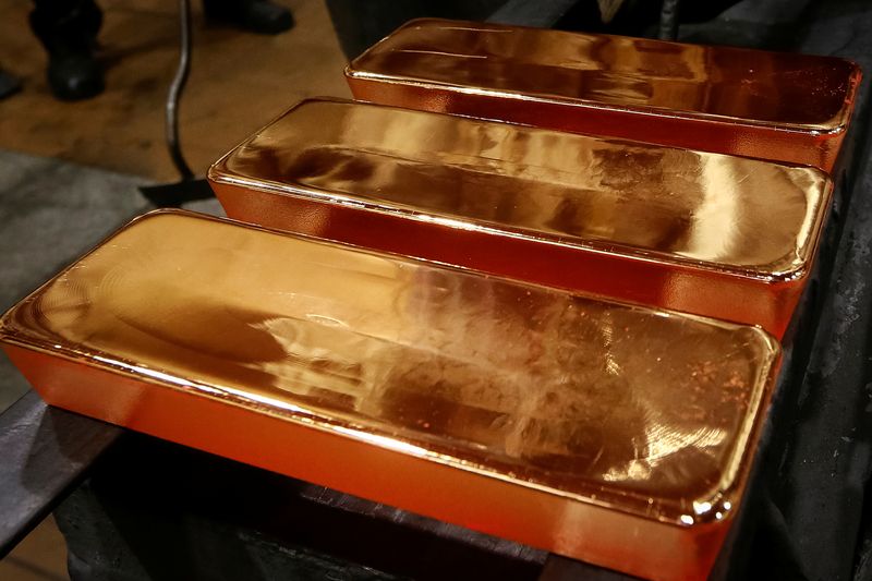 &copy; Reuters. Employees process ingots of 99.99 percent pure gold at the Krastsvetmet non-ferrous metals plant, one of the world's largest producers in the precious metals industry, in the Siberian city of Krasnoyarsk, Russia November 22, 2018.  REUTERS/Ilya Naymushin