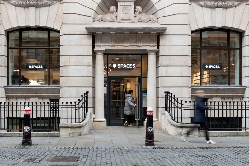 &copy; Reuters. FILE PHOTO: A person enters a Spaces office workspace, an IWG brand, in London, Britain, December 1, 2021. REUTERS/May James