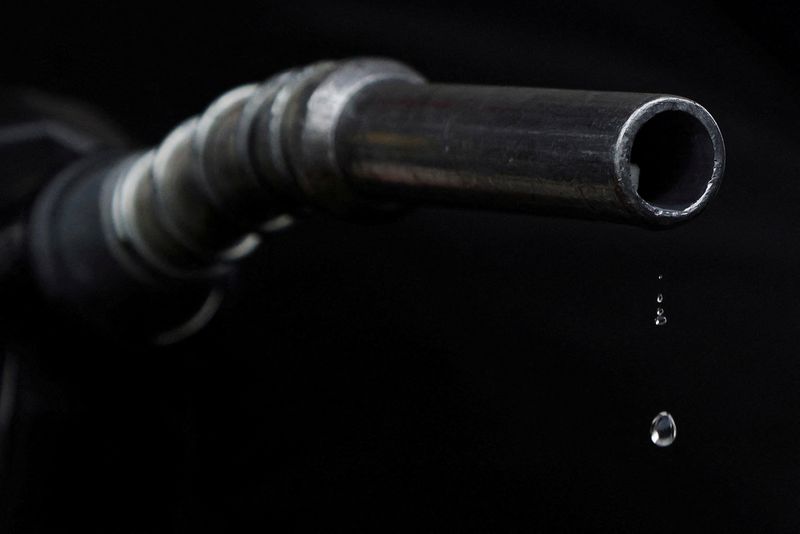 &copy; Reuters. FILE PHOTO: Gasoline drips out of a nozzle held by a gas station mechanic in Somerville, Massachusetts, U.S., March 7, 2022.  REUTERS/Brian Snyder