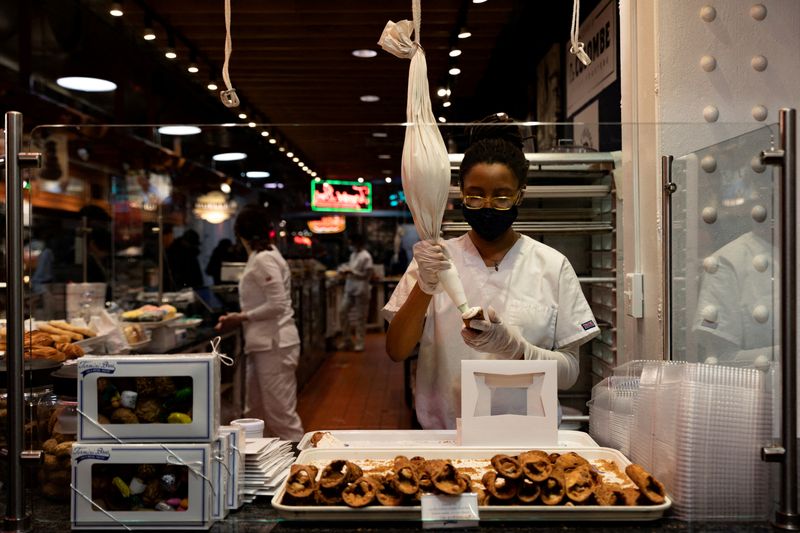 &copy; Reuters. FILE PHOTO: A worker fills a cannoli at a bakery at Reading Terminal Market after the inflation rate hit a 40-year high in January, in Philadelphia, Pennsylvania, U.S. February 19, 2022.  REUTERS/Hannah Beier