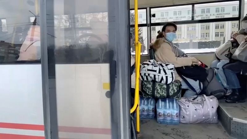 © Reuters. Civilians sit inside a bus with bottled water and belongings during evacuations, amid the Russian invasion of Ukraine, out of Sumy, March 8, 2022 in this still image obtained from handout video. Deputy Head for President's Office, Ukraine/Handout via REUTERS 