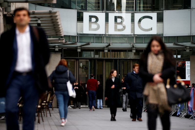 &copy; Reuters. FILE PHOTO: Pedestrians walk past a BBC logo at Broadcasting House in London, Britain, January 29, 2020. REUTERS/Henry Nicholls//File Photo