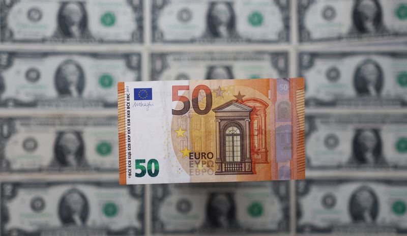 &copy; Reuters. A Euro banknote is displayed on U.S. Dollar banknotes in this illustration taken, February 14, 2022. REUTERS/Dado Ruvic/Illustration