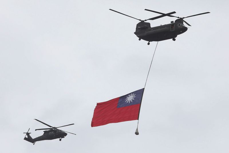 &copy; Reuters. FILE PHOTO: A Taiwan flag flews across the sky during National Day celebrations in Taipei, Taiwan, October 10, 2020. REUTERS/Ann Wang/File Photo