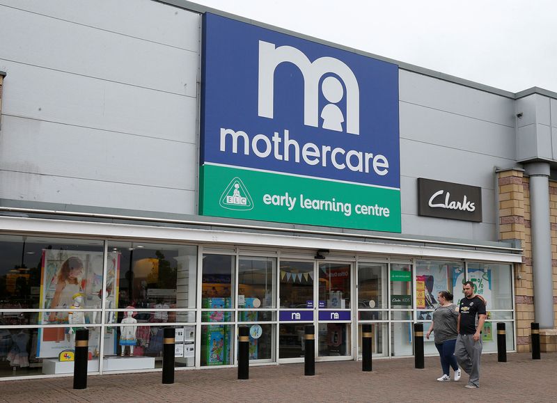 &copy; Reuters. FILE PHOTO: People walk past a Mothercare store in Altricham, Britain, May 16, 2018. REUTERS/Andrew Yates