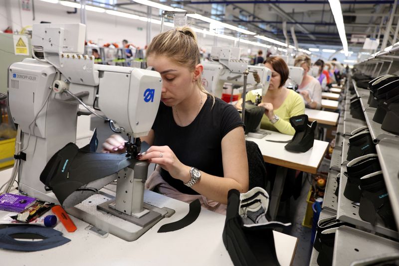 &copy; Reuters. FILE PHOTO: Women sew parts for shoes at the Skrebic footware factory, in Teslic, Bosnia and Herzegovina, February 17, 2022. Picture taken February 17, 2022. REUTERS/Dado Ruvic