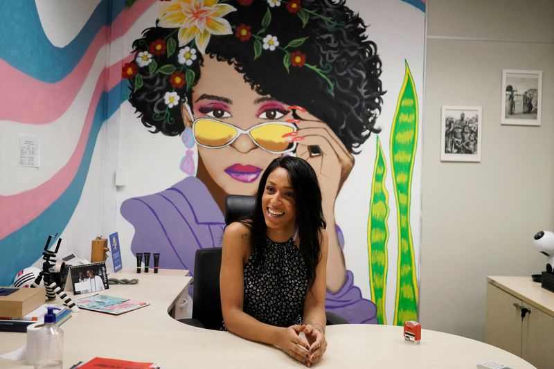 &copy; Reuters. Erika Hilton, who became the first transgender councilor elected by the city of Sao Paulo talks to an assistant in her office after an interview, in Sao Paulo, Brazil, February 25, 2022. Picture taken February 25, 2022. REUTERS/Alexandre Meneghini